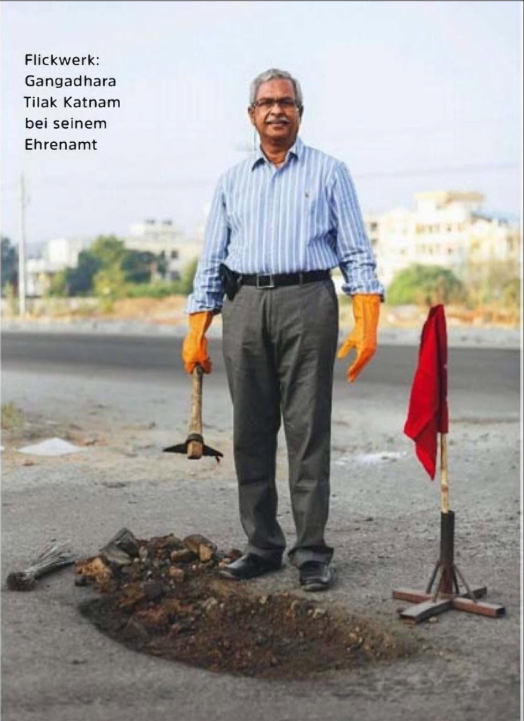 German newspaper photograph of Gangadhara Tilak Katnam standing beside a pothole with his road-repair tools